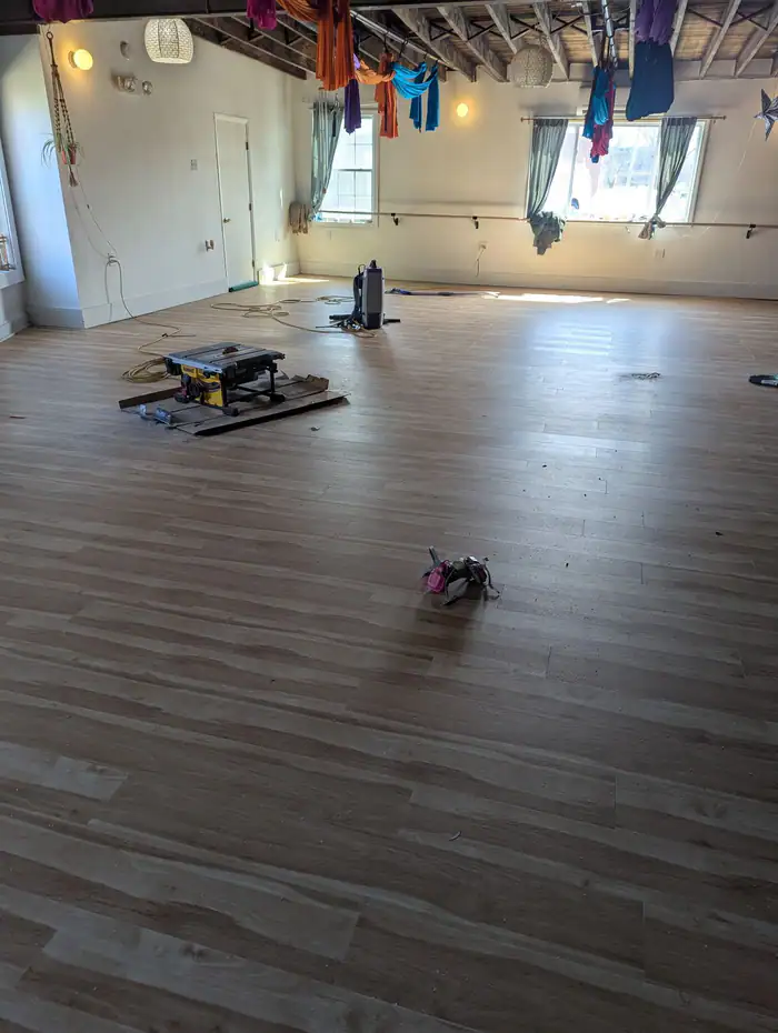 New plank floor nearly finished across a studio