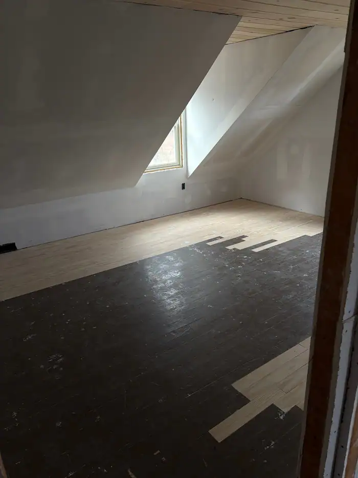 Attic floor stripped back during a repair