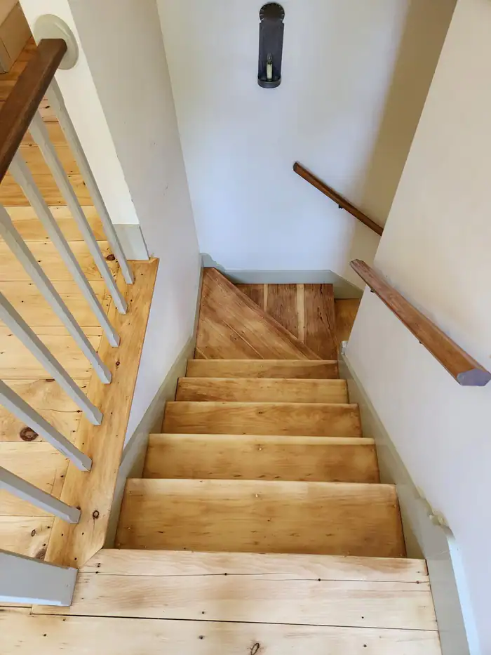 Pine stair treads sanded bare, ready for finish