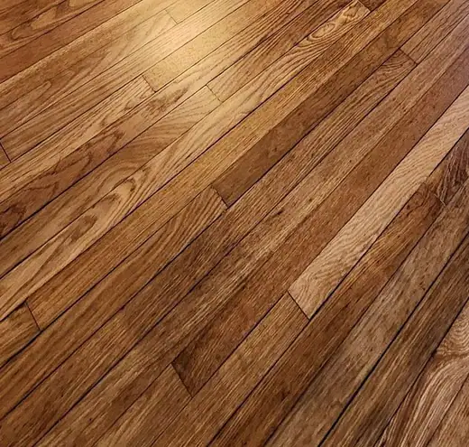 Close-up of a finished floor: golden, high gloss