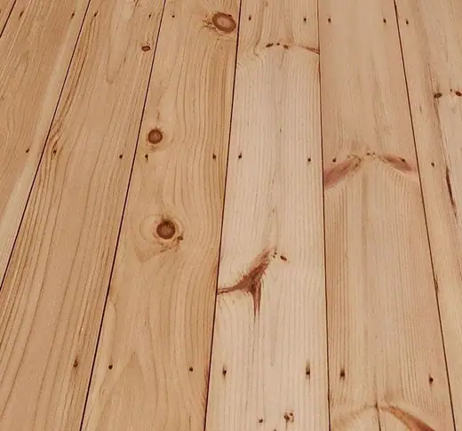 Close-up of a finished floor: clear on wide pine