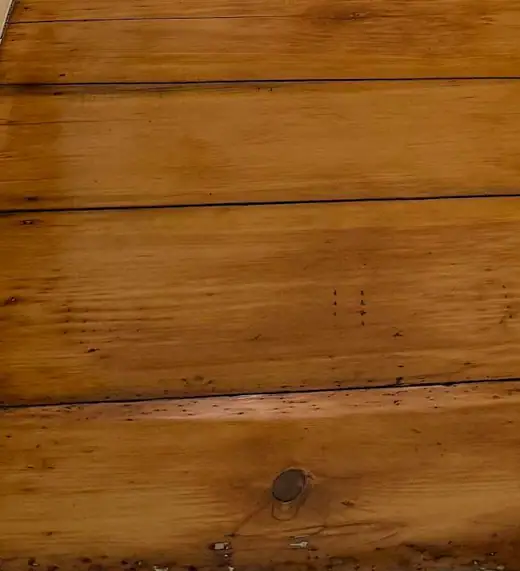 Close-up of a finished floor: old boards, revived